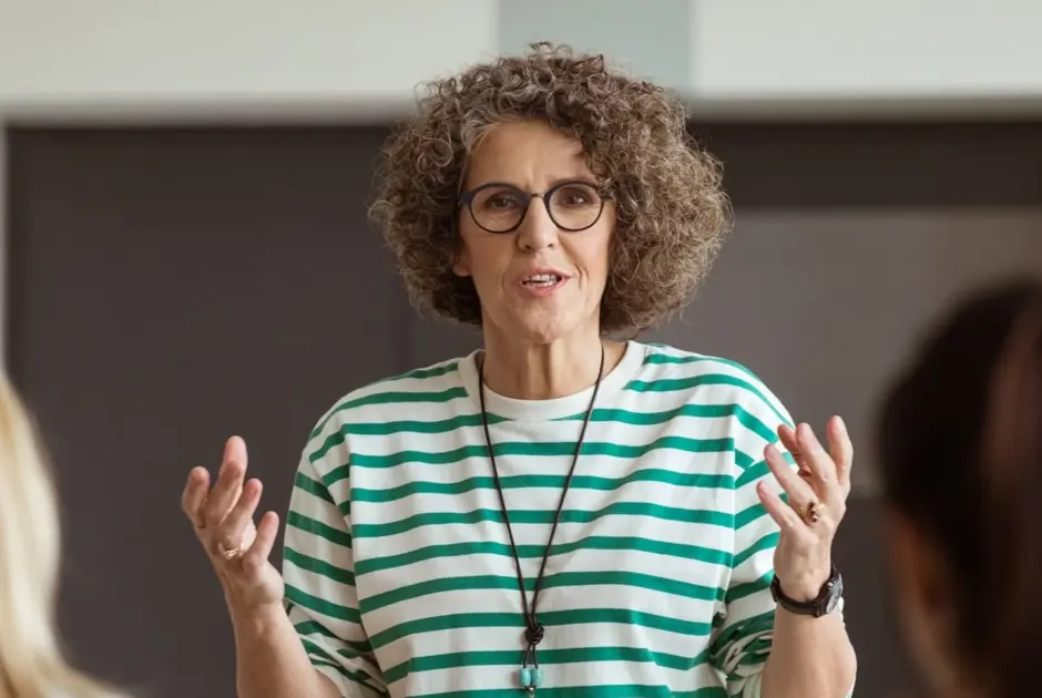 A woman leading a leadership development programme.